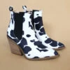 Tall Ankle Booties With Side Elastic And Stacked Heel-Black And White Cow Print